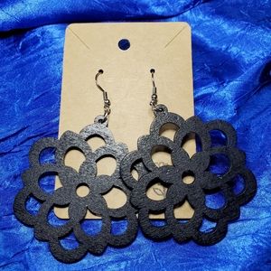 Black wooden flower cut out earrings. Simple but very Bold.